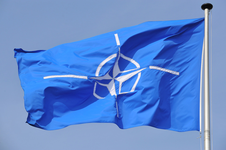 NATO flag flying at NATO Headquarters Brussels.