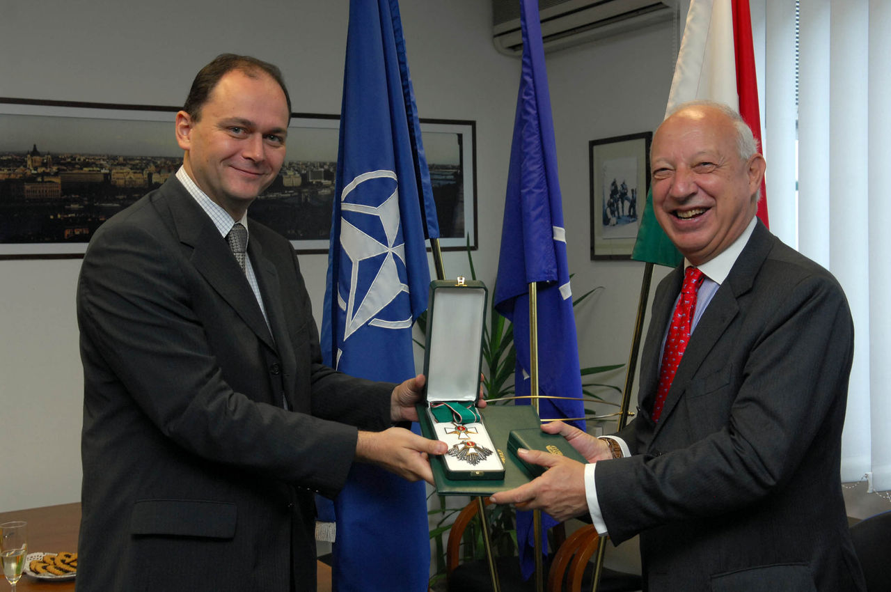 Outgoing NATO Deputy Secretary General, Ambassador Alessandro Minuto Rizzo receives the Commander's Cross with the Star of the Order of the Merit of the Republic of Hungary from Ambassador Zoltan Martinusz
