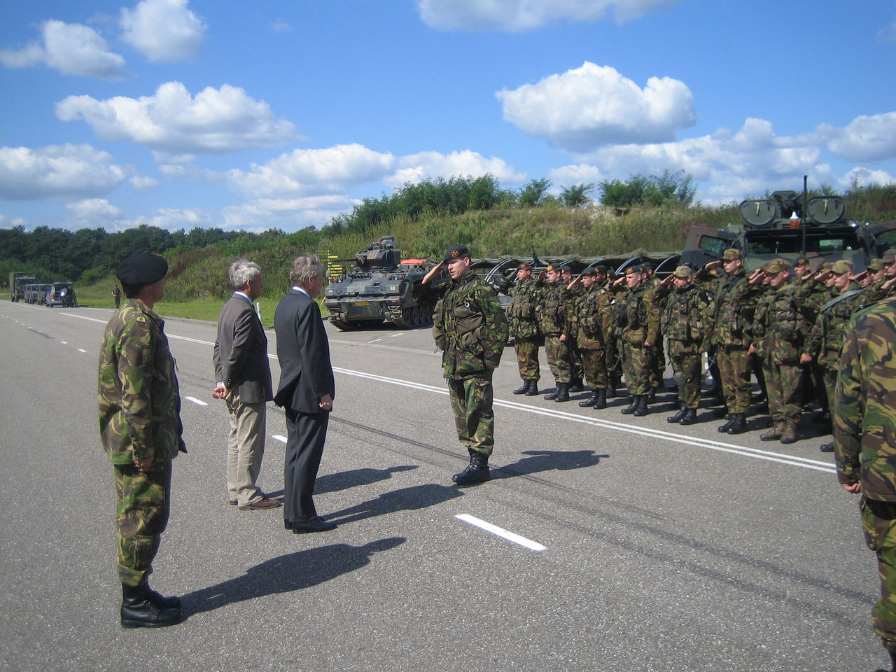 The NATO Secretary General and the Dutch Minister of Defense Eimert van Middelkoop inspect troops before they demonstrate a patrol as performed in Uruzgan, Afghanistan. This patrol operates as a SUA (Smallest Unit of Action), in which different specialties are incorporated.