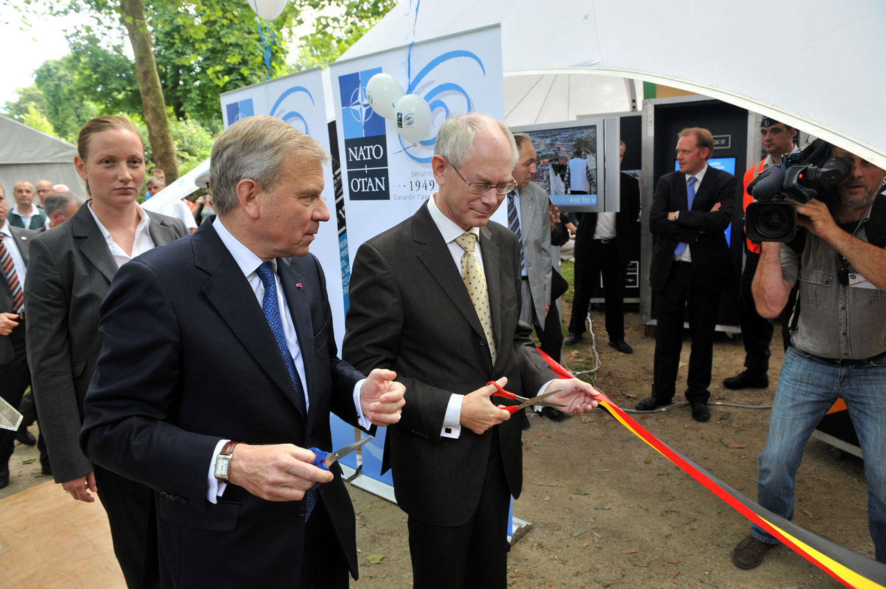 Official opening of the NATO Village
Left to right:  NATO Secretary General, Jaap de Hoop Scheffer and Herman Van Rompuy (Prime Minister of Belgium) cutting the ribbon and officially opening the NATO Village