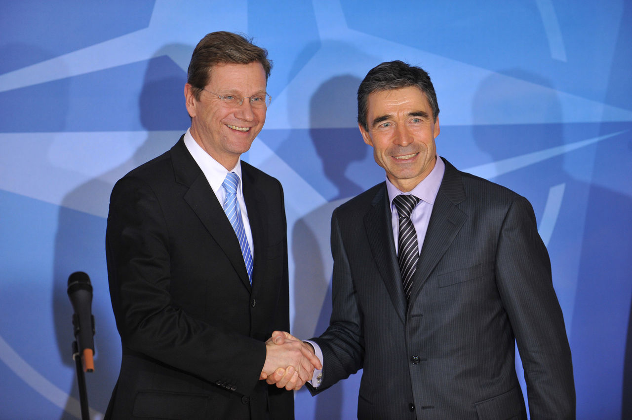 NATO Secretary General Anders Fogh Rasmussen and the Minister of Foreign Affairs of Germany Guido Westerwelle shake hands after the press conference.