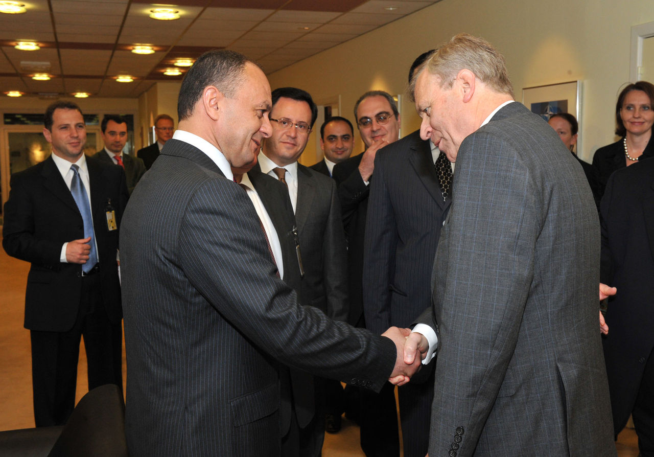 Left to right: Seyran Ohanyan (Minister of Defence, Armenia) shaking hands with NATO Secretary General, Jaap de Hoop Scheffer.