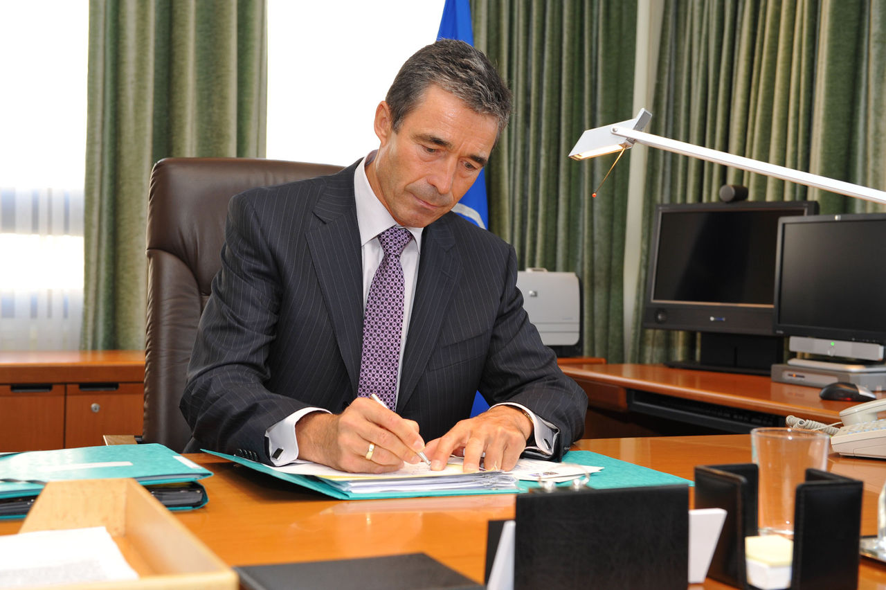 New Secretary General, Anders Fogh Rasmussen sits at his desk for the first time 