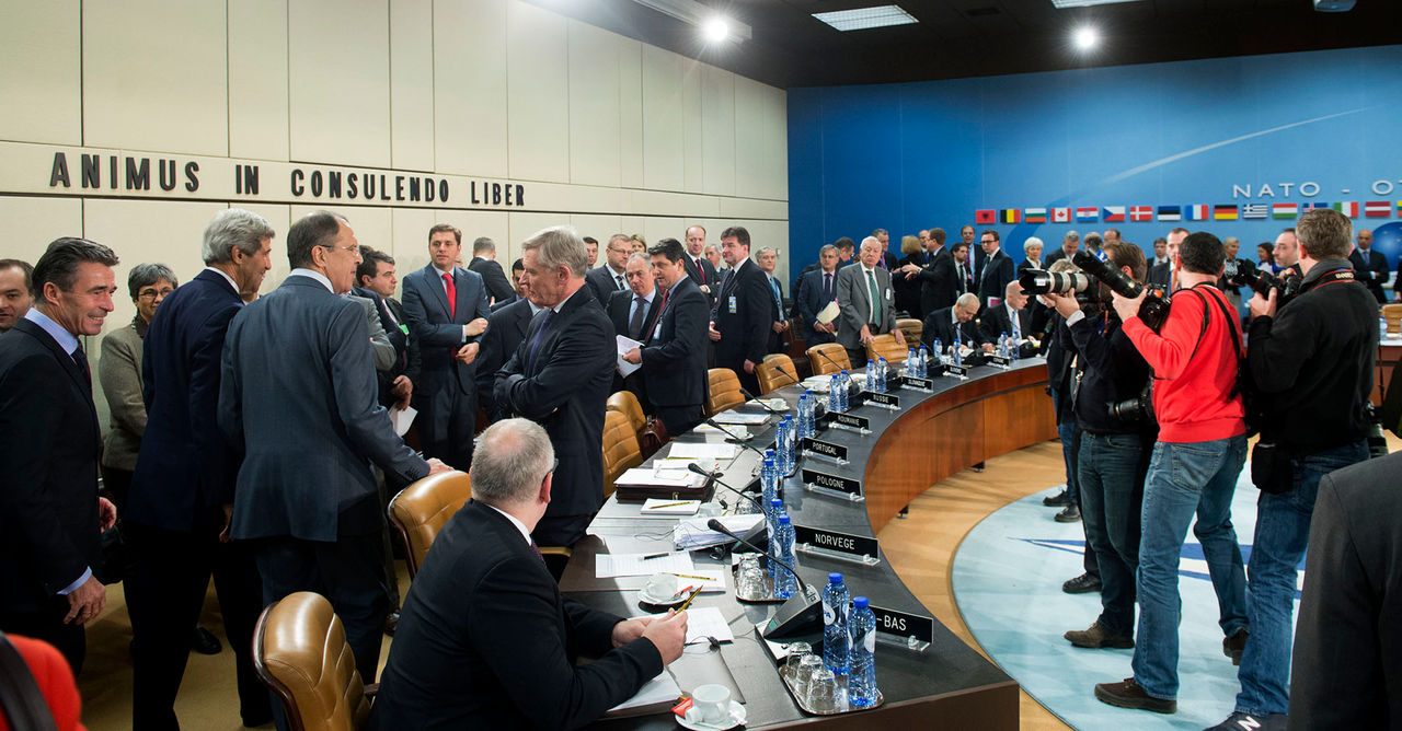Left to right: NATO Secretary General Anders Fogh Rasmsussen walking into the meeting room with John F. Kerry (US Secretary of State) and Sergey Lavrov (Minister of Foerign Affairs, Russian Federation)