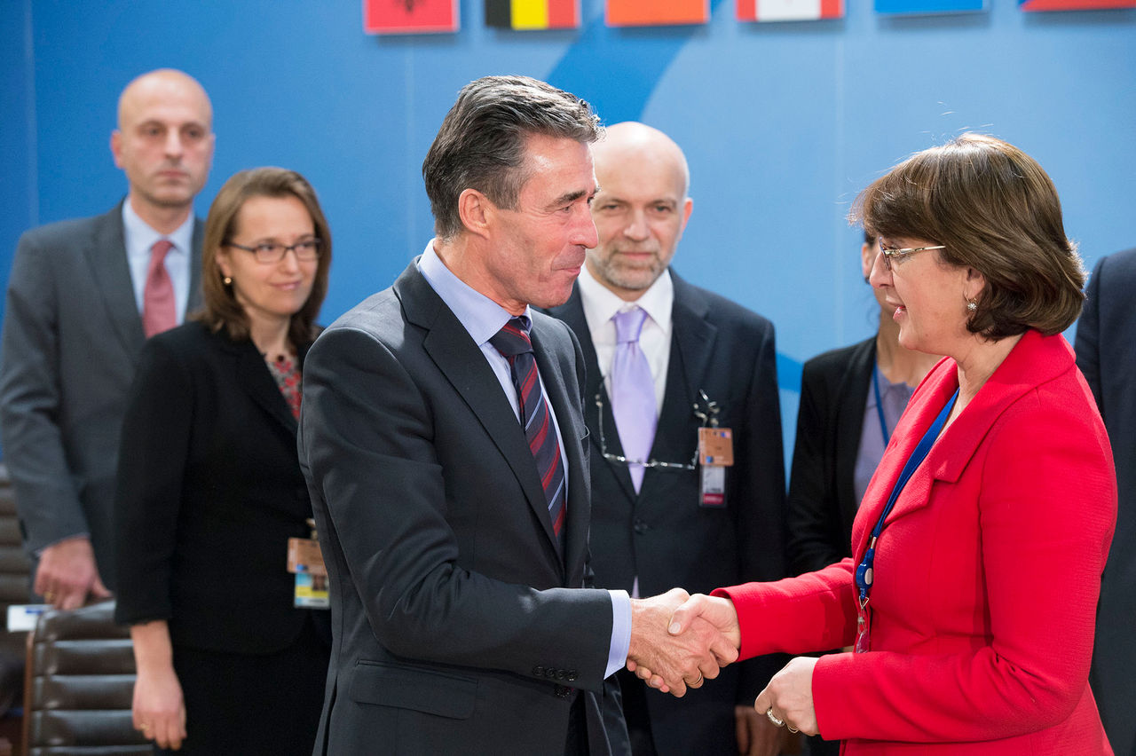 Left to right: NATO Secretary General Anders Fogh Rasmussen shaking hands with Maia Panjikidze (minister of Foreign Affairs, Georgia)