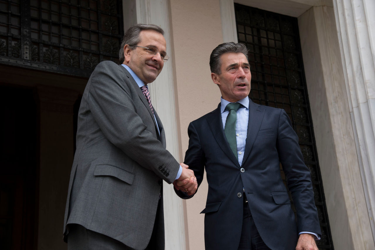 NATO Secretary General Anders Fogh Rasmussen is  welcomed by Greek Prime Minister Antonis Samaras