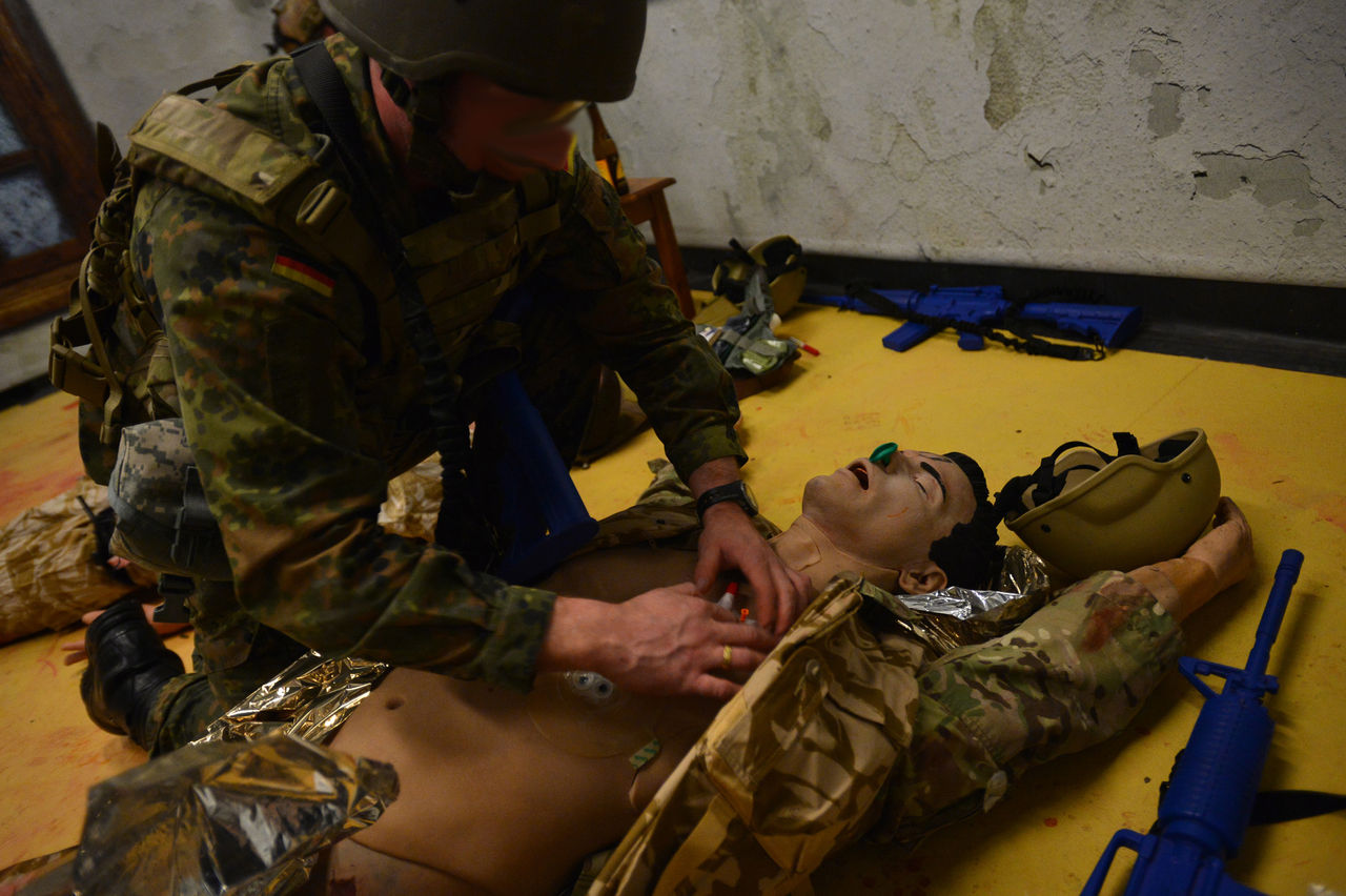 A German Army SOF medic attends to a mannequin with a chest wound at the ACME training facility in February 2014. The ACME serves as research and testing capability, testing SOF-specific medical equipment in a simulated environment.