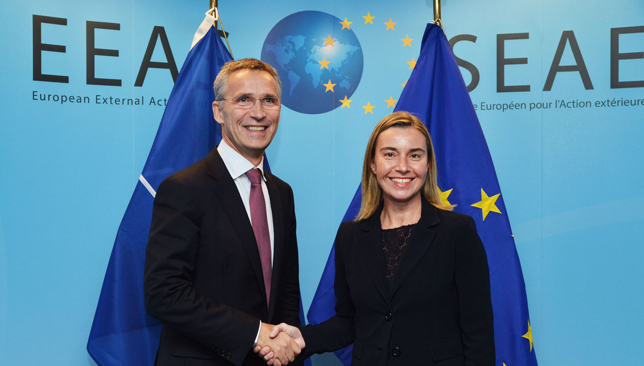 NATO Secretary General, Jens Stoltenberg shaking hands with EU High Representarive Federica Mogherini