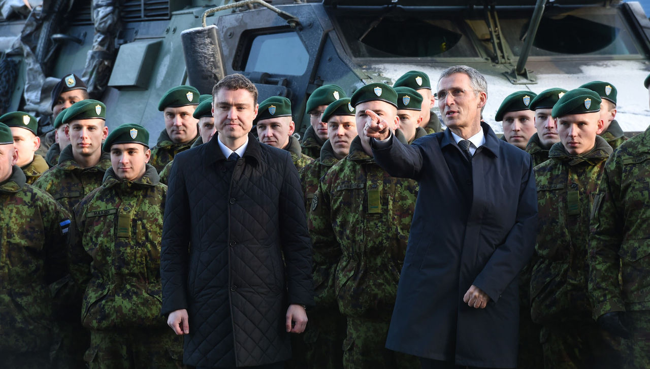 NATO Secretary General Jens Stoltenberg and Prime Minister Taavi Roivas of Estonia meet troops conducting the Baltic Air Police Mission at Amari airbase, Estonia