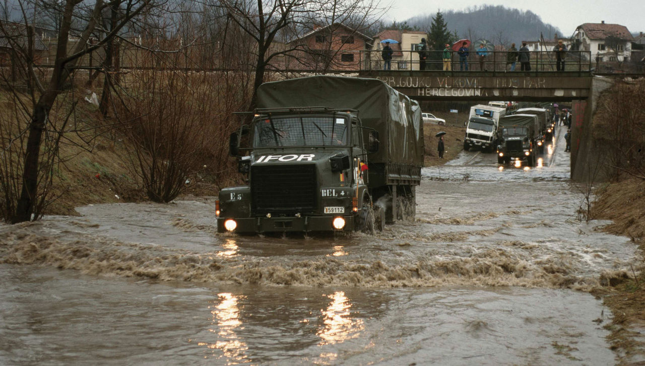 Six days after the signing of the Dayton Peace Agreement, NATO deployed a UN-mandated Implementation Force (IFOR) in Bosnia and Herzegovina, relieving the UN peacekeeping force in place since 1992. IFOR consisted of 50,000 troops provided by NATO member countries and 10,000 troops provided by non-NATO contributors.