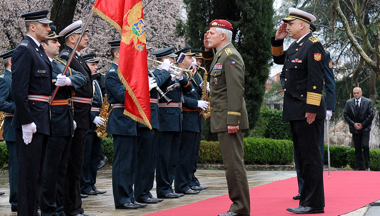 General Petr Pavel, Chairman of the NATO Military Committee and Admiral Dragan Samardzic, Chief of the General Staff of the Montenegrin Armed Forces salute the Montenegrin Flag