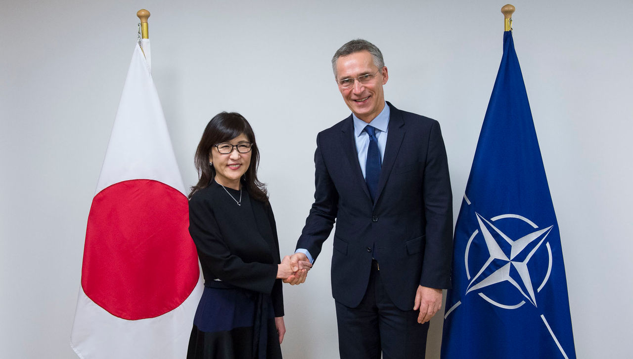 NATO Secretary General Jens Stoltenberg greets the Minister of Defence of Japan, Tomomi Inada