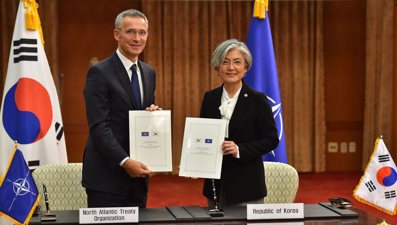 NATO Secretary General Jens Stoltenberg and the Minister of Foreign Affairs of the Republic of Korea, Ms Kang Kyung-wha after signing the Individual Partnership and Cooperation Programme