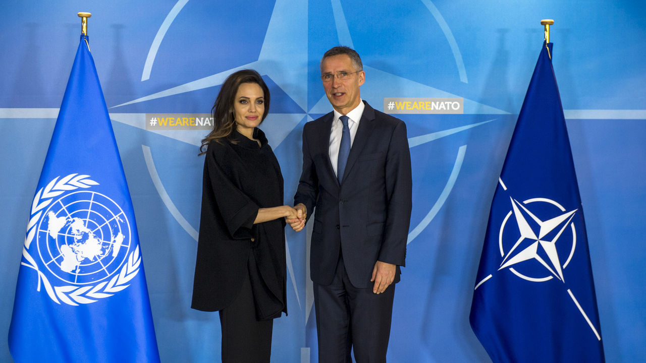 NATO Secretary General Jens Stoltenberg greeting Angelina Jolie (UN High Commissioner for Refugees Special Envoy) upon her arrival to NATO Headquarters