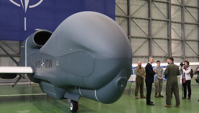 NATO Secretary General Jens Stoltenberg being briefed on the Alliance Ground Surveillance aircraft