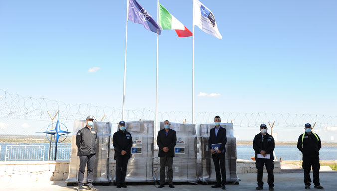 Col. Edmond Voci, Albanian Military Attaché in Italy, and Maj. Bekim Murjia from Albania collect 60 ventilators from the NATO stockpile at the NSPA South Operational Centre in Taranto, Italy on 16 October.