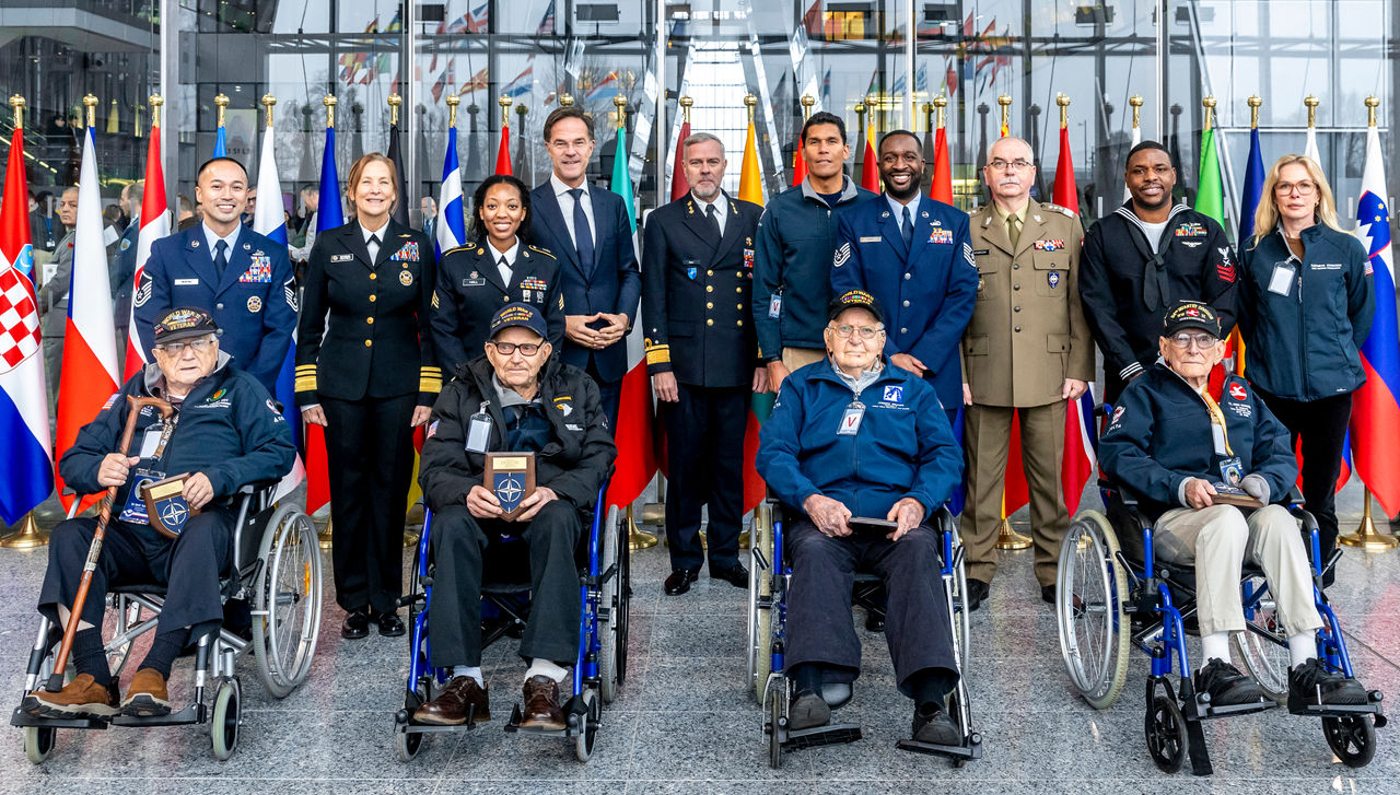 Mark Rutte, NATO Secretary General, Rob Bauer, NATO CMC and Shoshana Simone Chatfield, US Military Representative at NATO, meet with US World War II veterans CPL John D. Foy, SSGT George K. Mullins, CPL Joseph R. Picard and PFC Fred J Nungesser Jr.