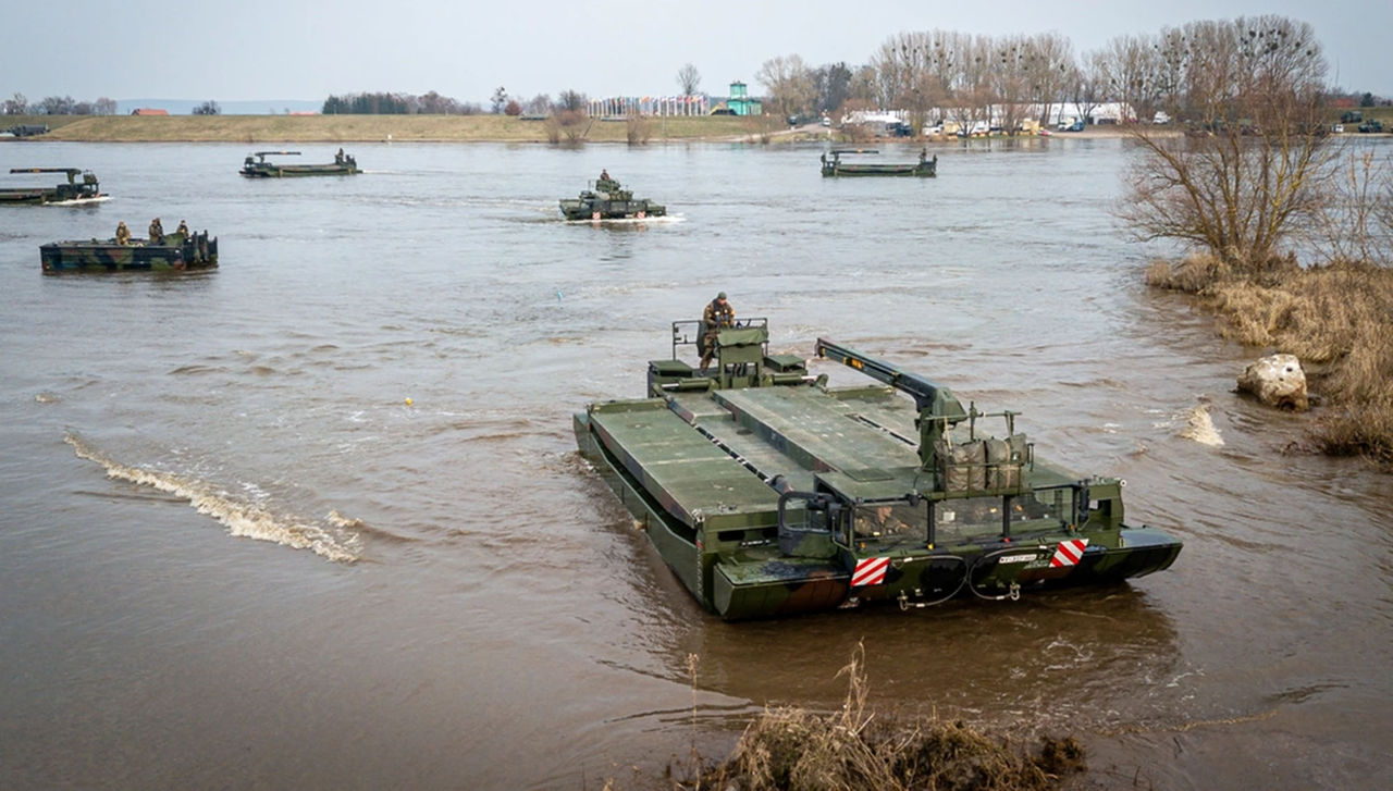 A M3 rig truck of the British-German amphibious engineer battalion arrives to shore and takes land, in Poland on March 3, 2024, as part of Exercise Dragon-24 (DR-24).