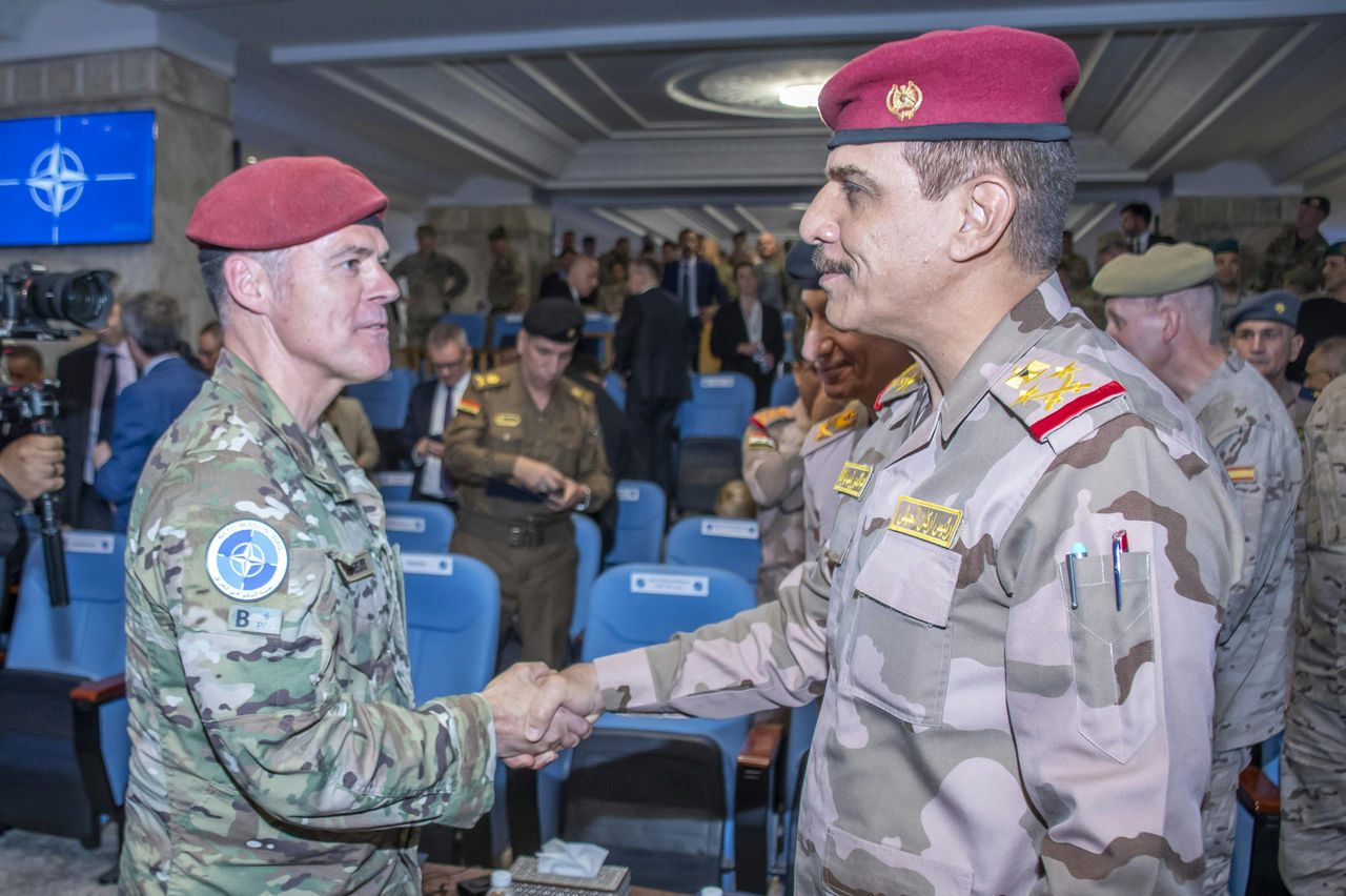 Lieutenant General Lucas Schreurs of the Netherlands shakes hands with Lieutenant General José Antonio Agüero Martínez of Spain