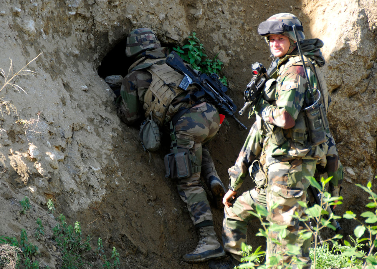 French Soldiers from the 1st armored company, patrol an area east of combat Outpost Dabo in the Uzbeen Valley of Afghanistan. The search was set up to investigate caves in the side of the cliffs in the Vally to determine if insurgents are using them for weapons caches.