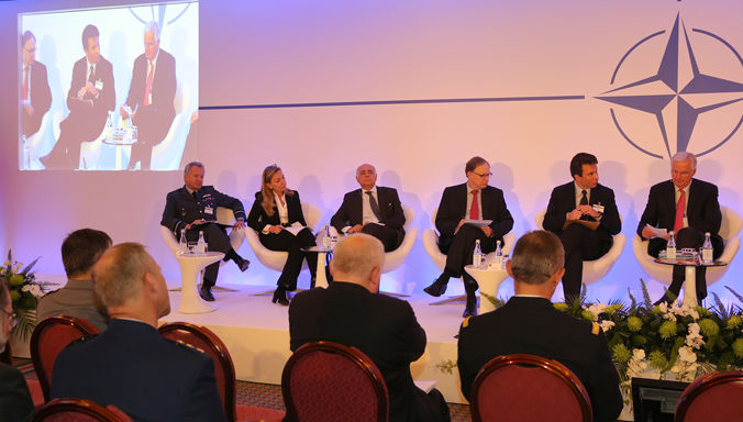 151020-N-HM950-084 LISBON, Portugal (Oct. 20, 2015) Panel members lead discussions on building opportunity during the NATO-Industry Forum (NIF). NIF is an annual event aimed at strengthening strategic dialogue between key actors involved in the military capability development process, and to identify and implement concrete collaborative projects between NATO and industry. (NATO photo by Senior Chief Mass Communication Specialist Aaron Glover/Released)