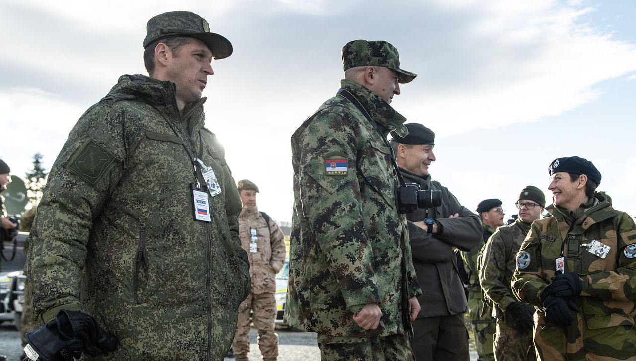 Military observers with the Russian Federation, left, and Serbia, center, watch a demonstration during Exercise Trident Juncutre 2018. Both Russia and Serbia are members of the Organization for Security and Cooperation in Europe, and they observed Trident Juncture at the invitation of NATO.