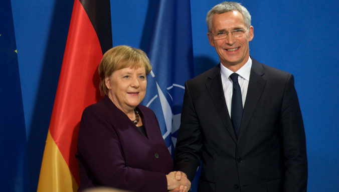 NATO Secretary General Jens Stoltenberg and German Chancellor Angela Merkel
