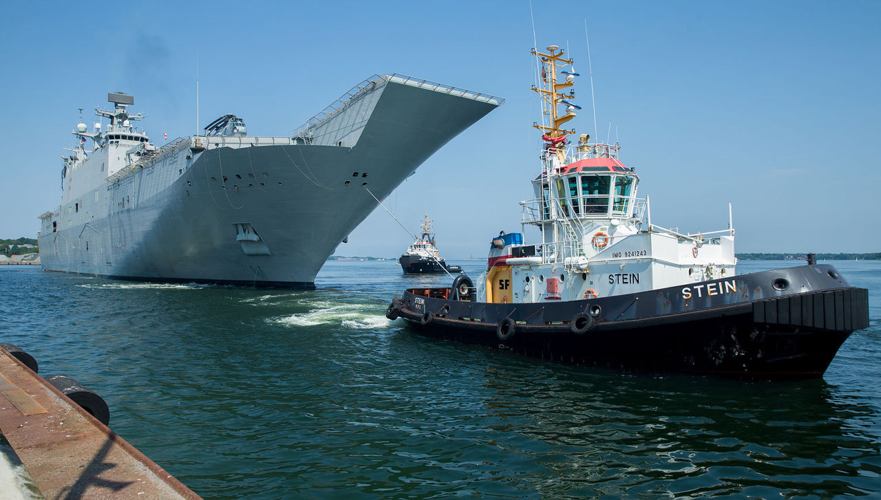 Spanish Navy multi-purpose amphibious assault ship Juan Carlos I (L61), prepares to moor at Naval Base Kiel-Tirpitzhafen, Germany in preparation of exercise Baltic Operations (BALTOPS) 2019, June 5, 2019. BALTOPS is the premier annual maritime-focused exercise in the Baltic region, marking the 47th year of one of the largest exercises in Northern Europe enhancing flexibility and interoperability among allied and partner nations. (U.S. Marine Corps photo by Cpl. Abrey Liggins)