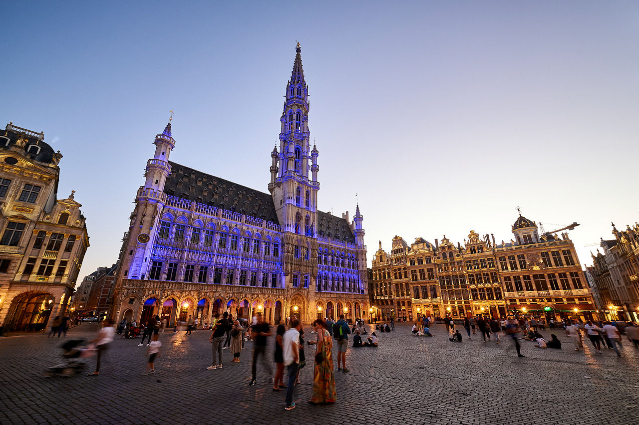 The Brussels Town Hall in the UNESCO-listed Grand Place illuminated in NATO blue