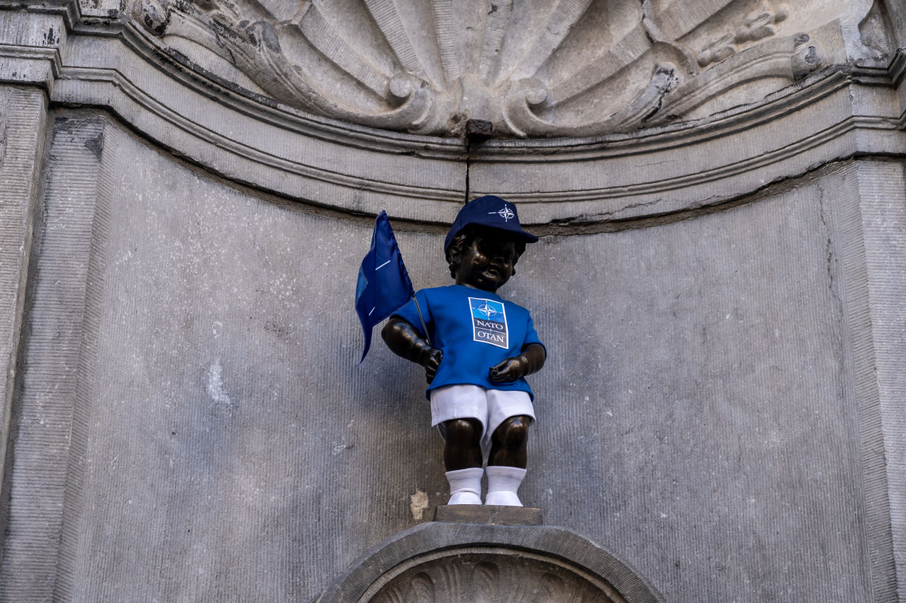 The Manneken Pis statue wears a NATO-branded outfit.