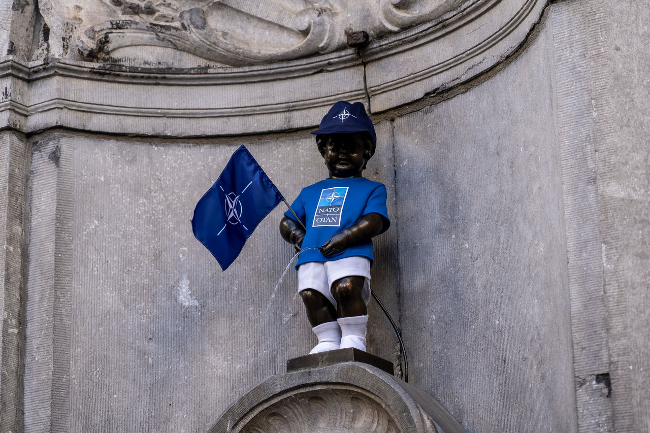 The Manneken Pis statue wears a NATO-branded outfit.