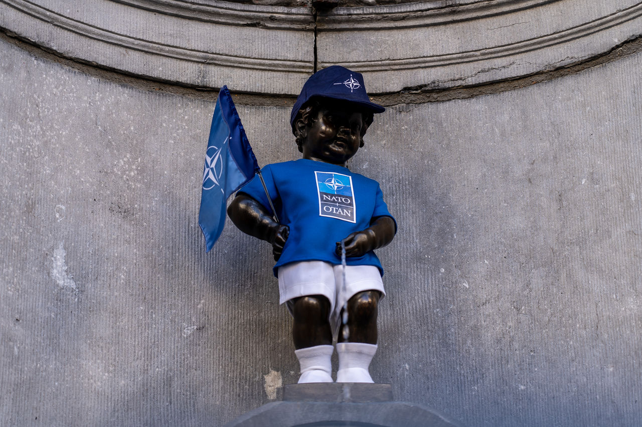 The Manneken Pis statue wears a NATO-branded outfit.