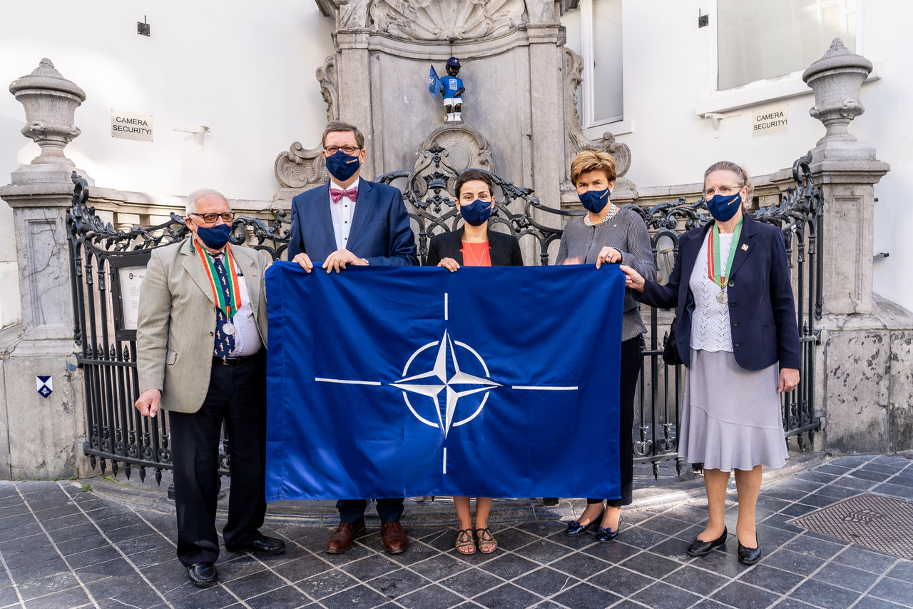 The Manneken Pis statue wears a NATO-branded outfit.