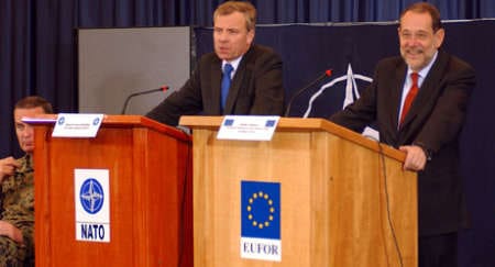 December 2004, Bosnia and Herzegovina: NATO Secretary General, Jaap de Hoop Scheffer (left) and the European Union High Representative, Dr Javier Solana mark the end of NATO's SFOR Operation and the establishment of the EU "ALTHEA" Operation(© NATO )
)
