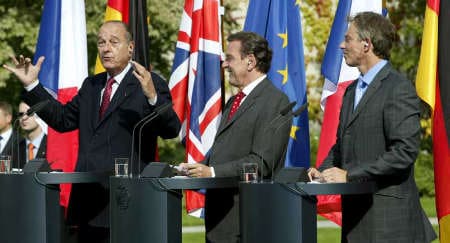 Friends again: President Chirac (left), Chancellor Schröder (centre) and Prime Minister Blair have put aside their differences over Iraq to revive European defence cooperation (© Reuters)
)