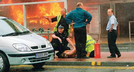 Police respond to a botched homegrown terrorist attack on Glasgow airport in 2007. The two assailants were a medical doctor and a PhD student.
)