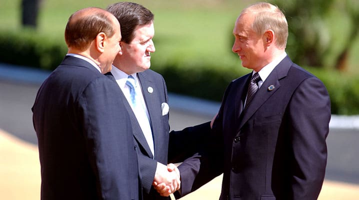 NATO Secretary General Lord Robertson (centre) shakes hands with Russian President Vladimir Putin with Italian Prime Minister Silvio Berlusconi in attendance at a NATO-Russia summit meeting in Rome. The Rome Declaration established the NATO-Russia Council as a mechanism for consultation, consensus-building, cooperation, joint decision and joint action – 28 May 2002 © NATO
)