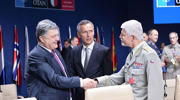 (Left to Right) President Petro Poroshenko, NATO Secretary General Jens Stoltenberg and Chairman of the NATO Military Committee Petr Pavel greet each other at the meeting of the NATO-Ukraine Commission in Warsaw, where Allied leaders pledged further support to Ukraine – 9 July 2016. © NATO
)