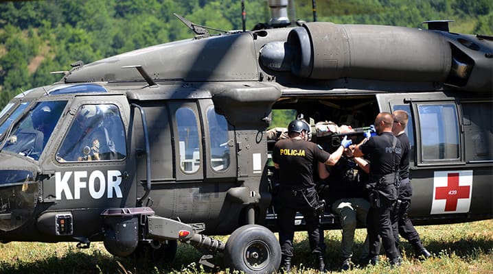 The NATO-led Kosovo Force, which was first deployed in 1999, has over the years supervised the stand-up and training of a multi-ethnic, professional and civilian-controlled Kosovo Security Force. Since 2017, a NATO Liaison and Advisory Team has provided capacity building support to security organisations in Kosovo from the executive to the force level. Pictured: A medical evacuation exercise takes place in Kosovo. © KFOR
)