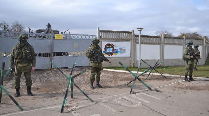 “Little green men” stand guard in front of the Sebastopol naval base after Russia’s illegal annexation of Crimea in March 2014.
)