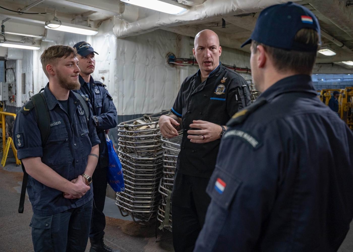 Allied sailors come on board the Ford during transit, including Dutch sailors from the HNLMS De Zeven Provincien.
)