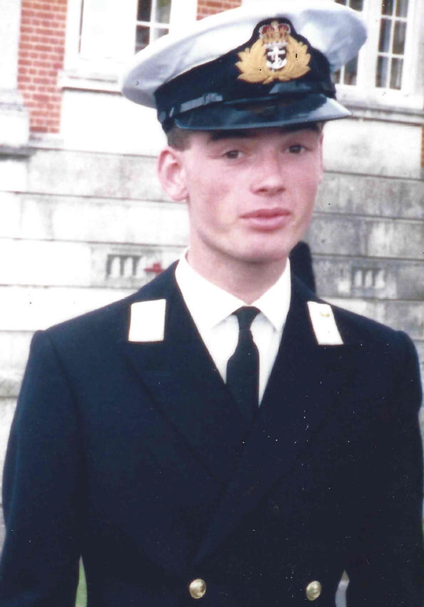 Edmund Hall serving as a British Royal Navy officer in 1988.
)