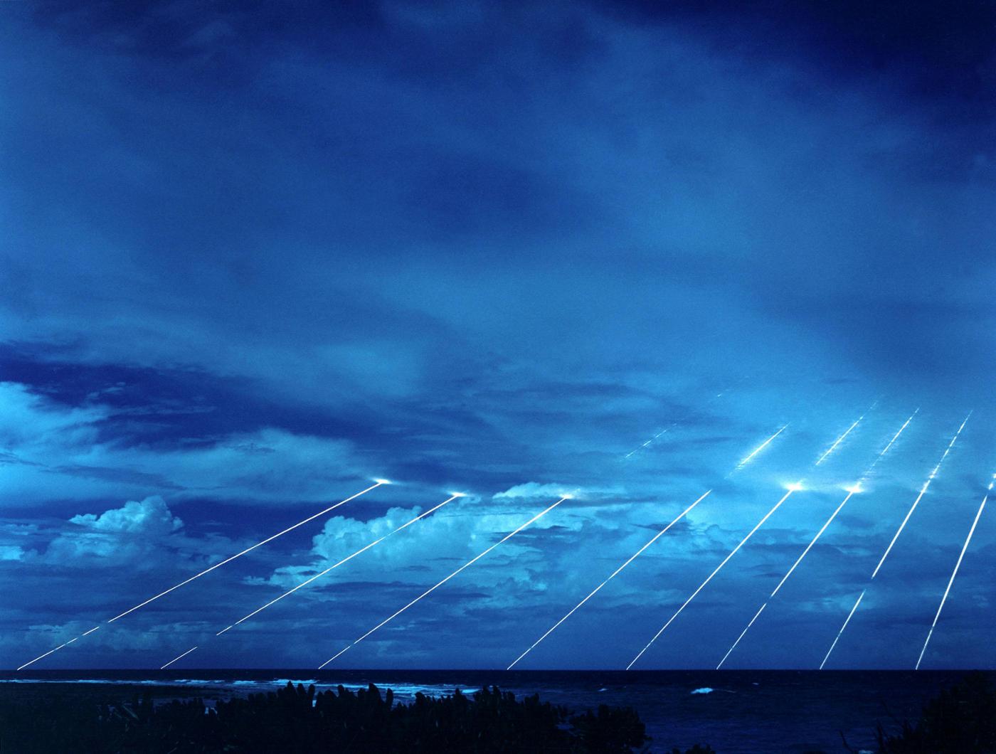 Testing of the ‘Peacekeeper’ reentry vehicles: all eight (of a possible ten) were fired from only one missile. Each line shows the path of an individual warhead captured on reentry via long-exposure photography. Photo © Wikipedia
)