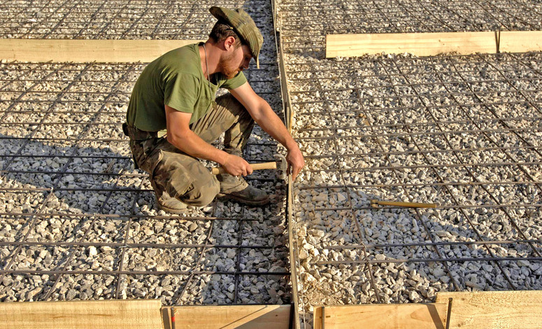 In one of the areas worst hit by a devastating earthquake in Pakistan in October 2005, NATO engineers supported the rebuilding of a village of Bagh. Here, a Spanish engineer helps build a new school.