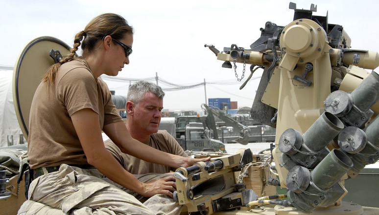 Kandahar Airfield, Afghanistan, 06 June 2007  Vehicle Maintenance section performs inspections  Canadian Forces technicians verify the function of a Remote Weapons System atop an RG 31 Armoured Personnel Vehicle at the Vehicle Maintenance section, Kandahar Airfield, Afghanistan. Weapons Technician Corporal Naomi Okimawininew (left) and Electronics/Optronics Technician Corporal Warren Westall, both from Deep River, Ontario, are currently serving with the Canadian Forces' Joint Task Force Afghanistan.  The Vehicle Maintenance section performs inspections, maintenance and repairs on trucks and armoured vehicles of all types used by the Canadian Forces in Afghanistan.  About 2500 members of the Canadian Forces (CF) are currently serving as part of Joint Task Force Afghanistan. Most of the soldiers are stationed at Kandahar Airfield and at Camp Nathan Smith, Canadaâ€™s Provincial reconstruction Team (PRT) in Kandahar City. Other personnel are assigned to various military headquarters, a support base, and civilian organizations.  They play a key role in the NATO-led International Security Assistance Force mission whose goal is to improve the security situation in Afghanistan and assist in rebuilding the country.  Canadian Forces Image Number IS2007-7128 By MCpl Kevin Paul, Canadian Forces Combat Camera ____________________________________________Traduction  AÃ©rodrome de Kandahar, Afghanistan, 6 juin 2007  La section de maintenance des vÃ©hicules procÃ¨de Ã  des inspections  Des techniciens des Forces canadiennes vÃ©rifient le fonctionnement dâ€™un systÃ¨me de tÃ©lÃ©commande de tir dans la partie supÃ©rieure dâ€™un vÃ©hicule blindÃ© RG 31 Ã  la section de maintenance des vÃ©hicules de lâ€™aÃ©rodrome de Kandahar en Afghanistan. Le Caporal Naomi Okimawininew (Ã  gauche), technicienne dâ€™armement, et le Caporal Warren Westall, technicien en Ã©lectronique/optoÃ©lectronique, les deux originaires de Deep River (Ontario), font actuellement partie de la Force opÃ©rationnelle int