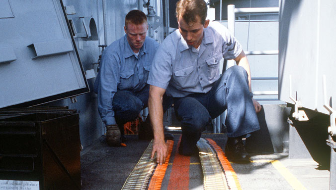 Gunner's mates inspect linked belts of Mark 149 Mod 2 20mm ammunition before loading it into the magazine of a Mark 16 Phalanx close-in weapons system aboard the battleship USS MISSOURI (BB-63).