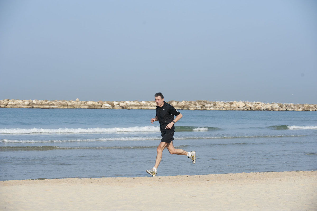 Fogh Rasmussen running during an official visit to Israel.
