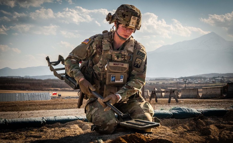 First Lieutenant Taylor Martin, Commander of US 720th Explosive Ordnance Disposal (EOD) Company, searches for explosives during a training exercise.

The EOD team’s role is to help clear some of the thousands of explosive remnants of war left over from past conflicts in Kosovo. EOD teams form part of the NATO-led Kosovo Force (KFOR), a multinational peacekeeping force mandated under United Nations Security Council Resolution 1244 of 1999 to ensure a safe and secure environment and freedom of movement for all communities in Kosovo.