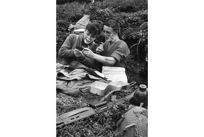 Soldiers shaving together during Northern Express