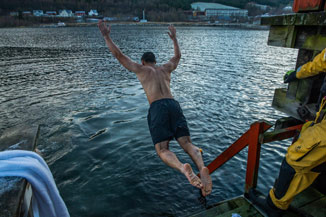 A US Marine leaps into the Flekkefjord Sea during a 